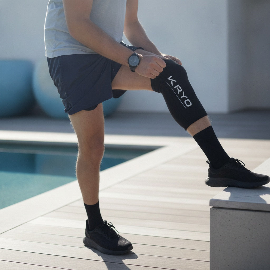 Athlete wearing KRYO CORE ice compression sleeve on knee for post-training recovery