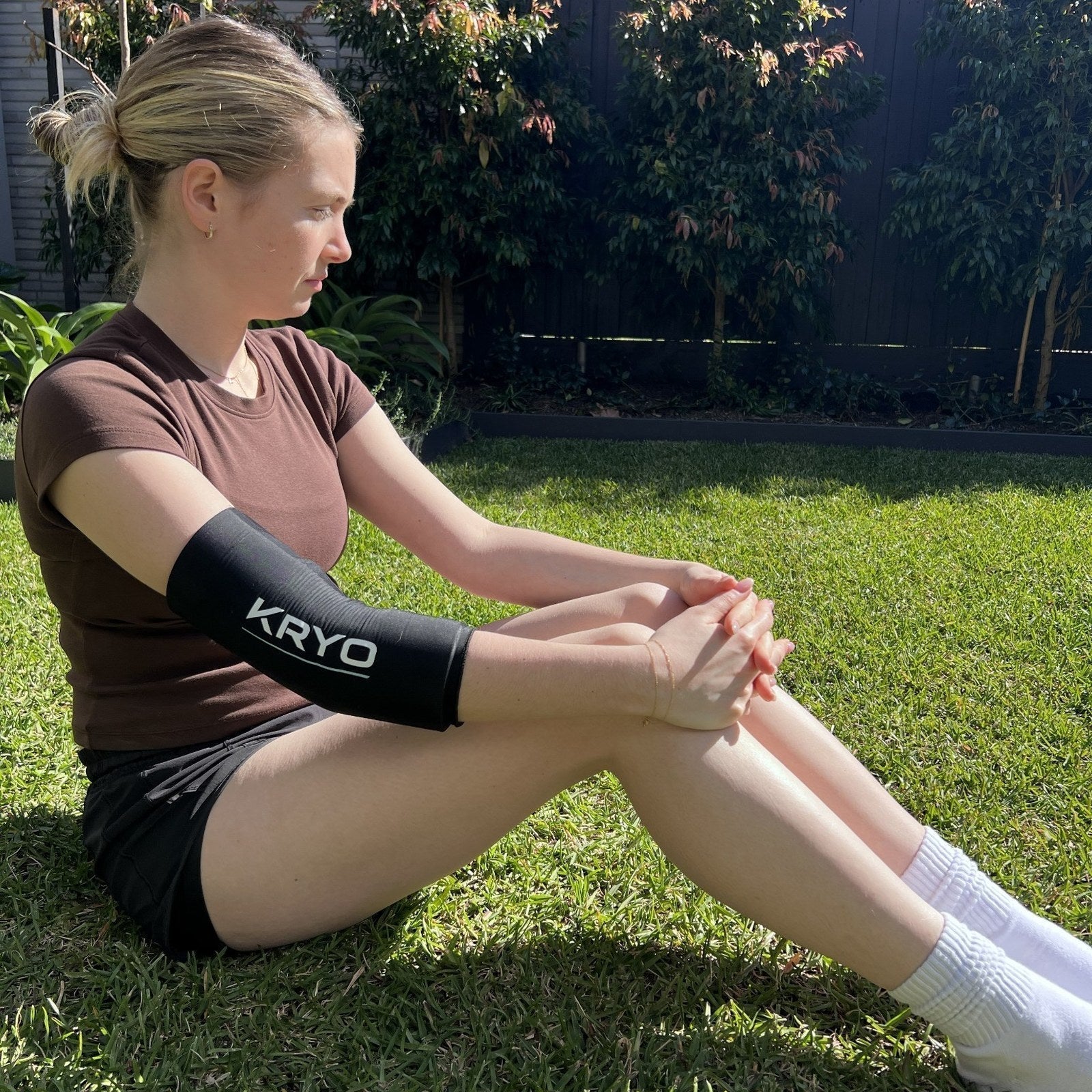 KRYO FLEX ice compression sleeve worn on the elbow and upper arm for post-exercise cold therapy and recovery