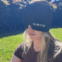 Woman wearing the KRYO Head Ice Cap outdoors, featuring soft, flexible gel coverage for the head, forehead and eyes.