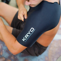 Close-up of an athlete wearing the KRYO Shoulder Sleeve, a reusable hot and cold compression sleeve designed for the shoulder, bicep and upper arm.