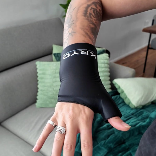 Close-up of a female athlete wearing the KRYO Wrist Ice Compression Sleeve, showing the snug fit and KRYO branding for targeted cold compression and wrist recovery.