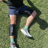 Runner recovering after a workout with KRYO MAX thigh and CORE calf ice compression sleeves